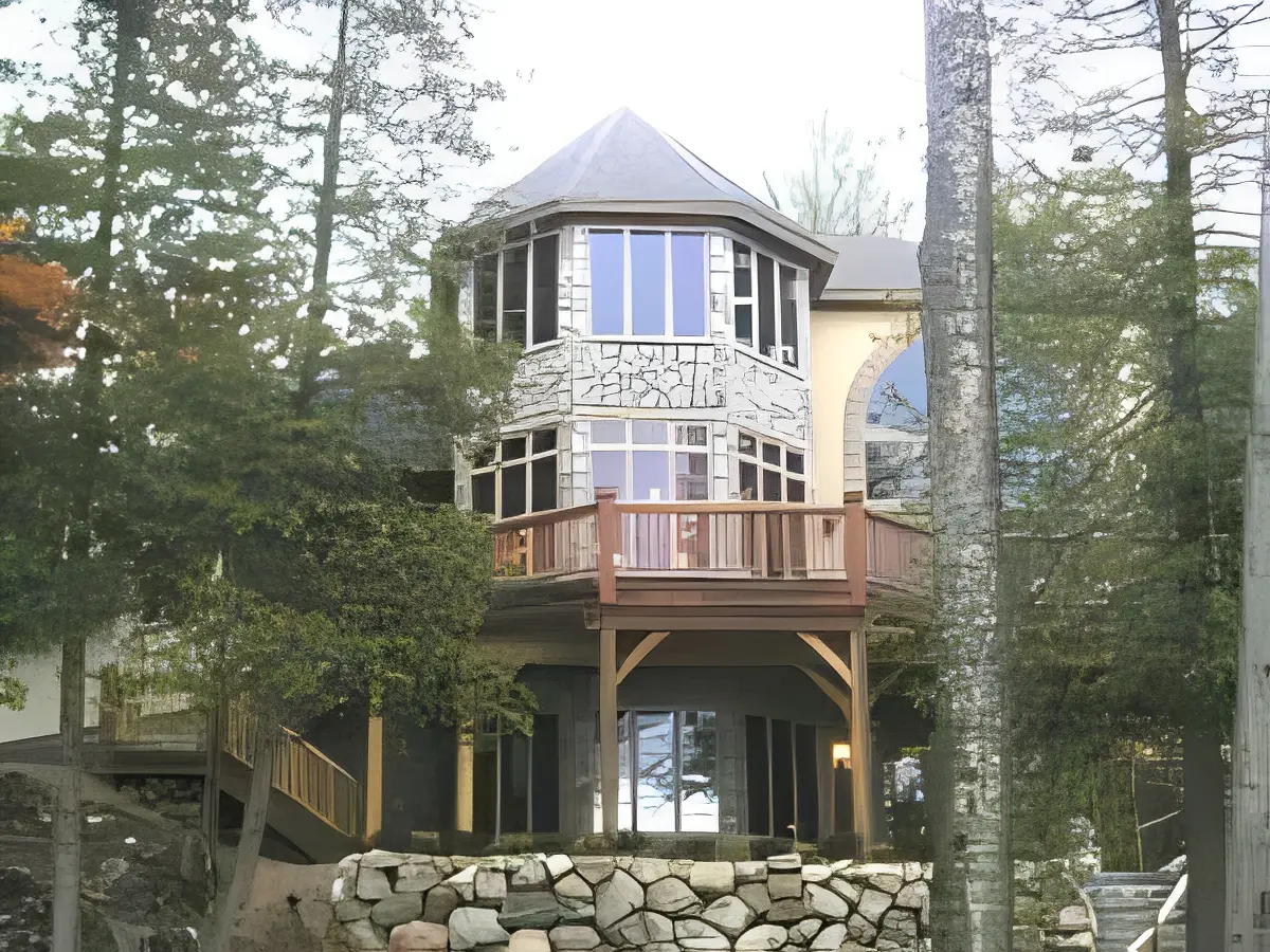 A unique two-story house with a rounded turret surrounded by trees.